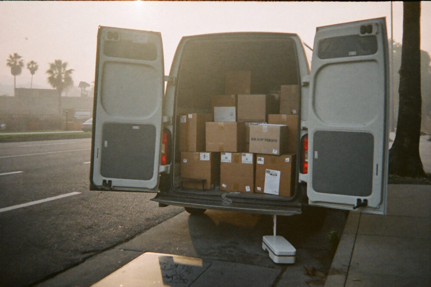 Cargo van loaded with parcels at sunrise