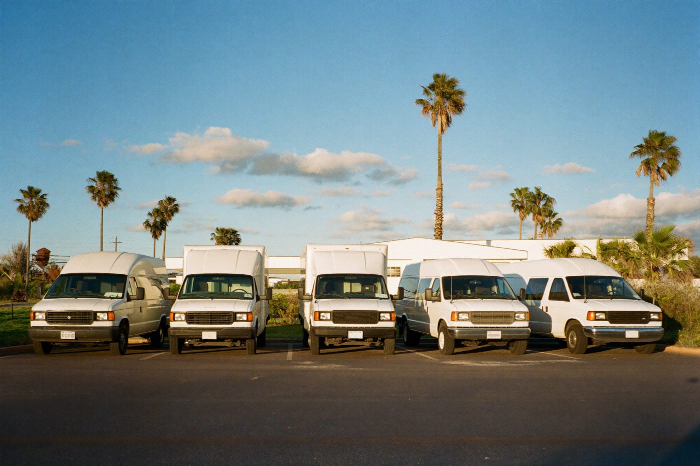 Row of trucks parked at sunrise